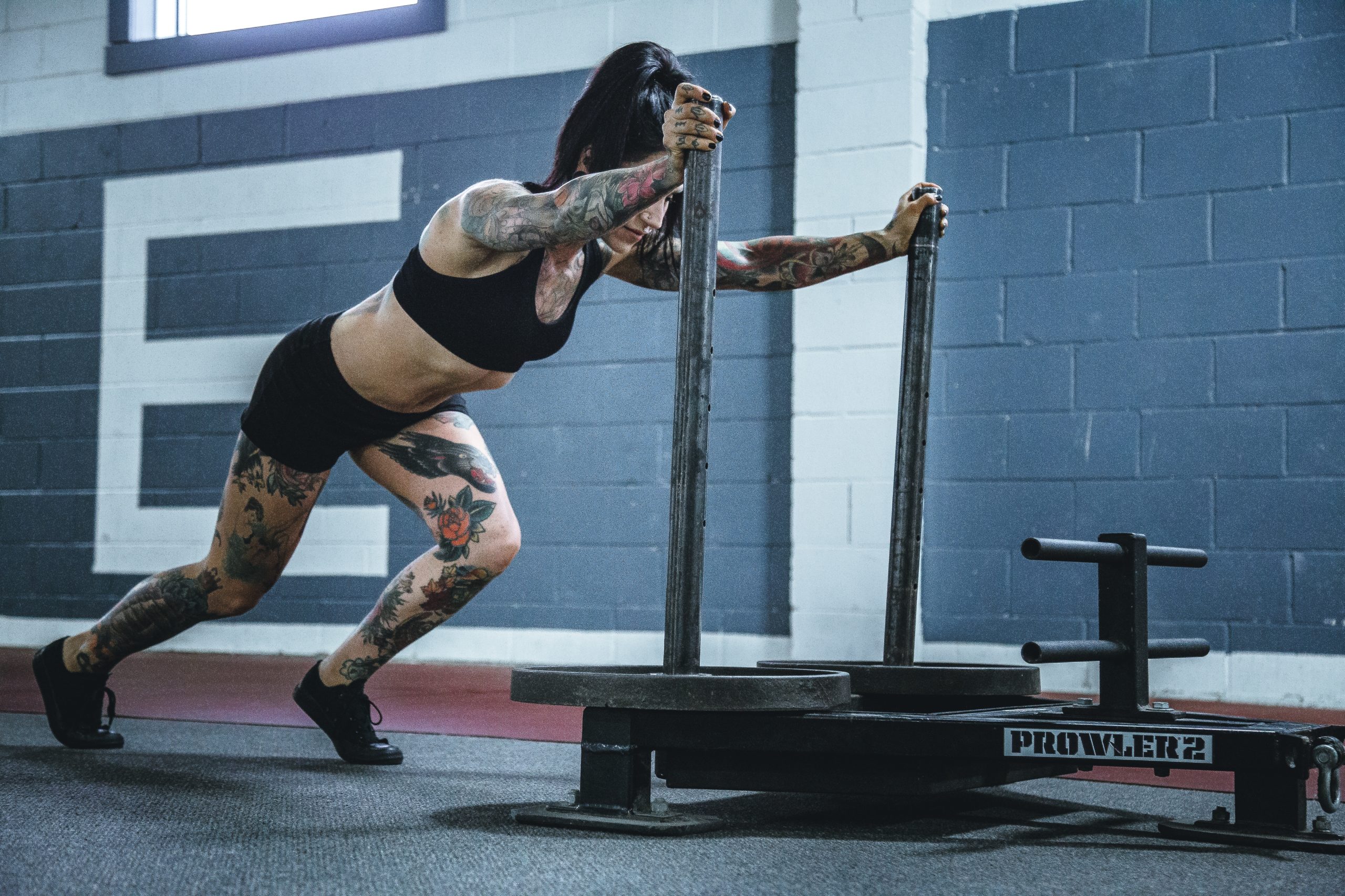 Woman Pushing Sled