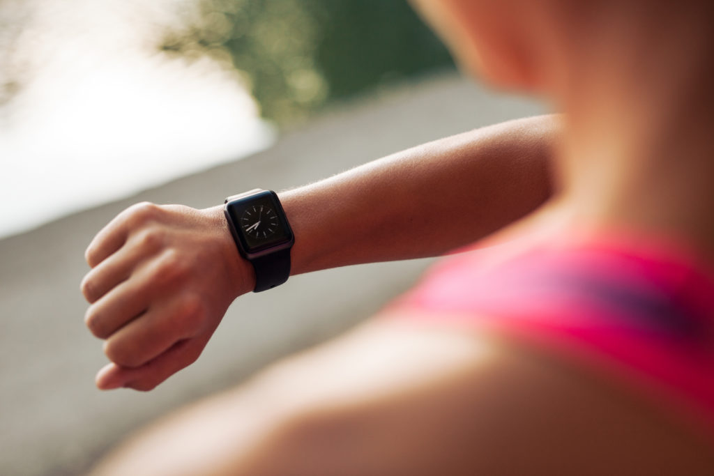 Woman Checks Watch During Training