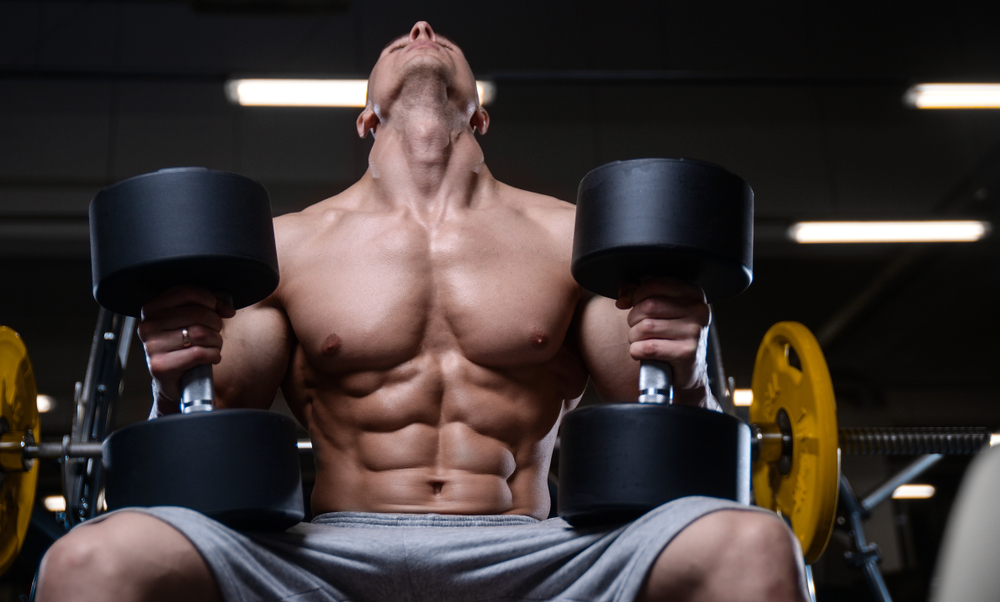 Bodybuilder stretching neck before training it